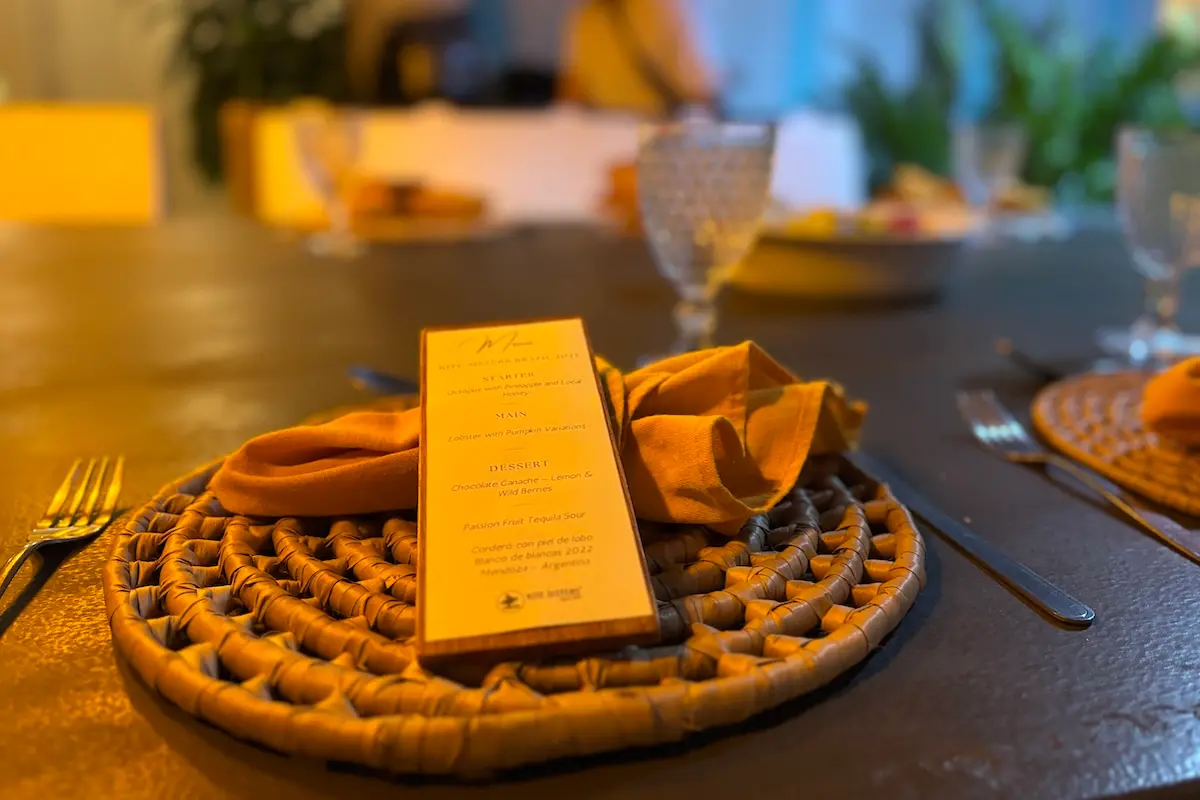 Kite Sisters Brazil kitesurf retreat gourmet dinner menu card with octopus lobster and chocolate ganache.