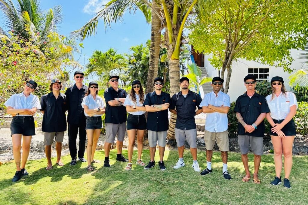 Kite Sisters complete team of kiteboarding instructors and staff in uniform in a tropical location.