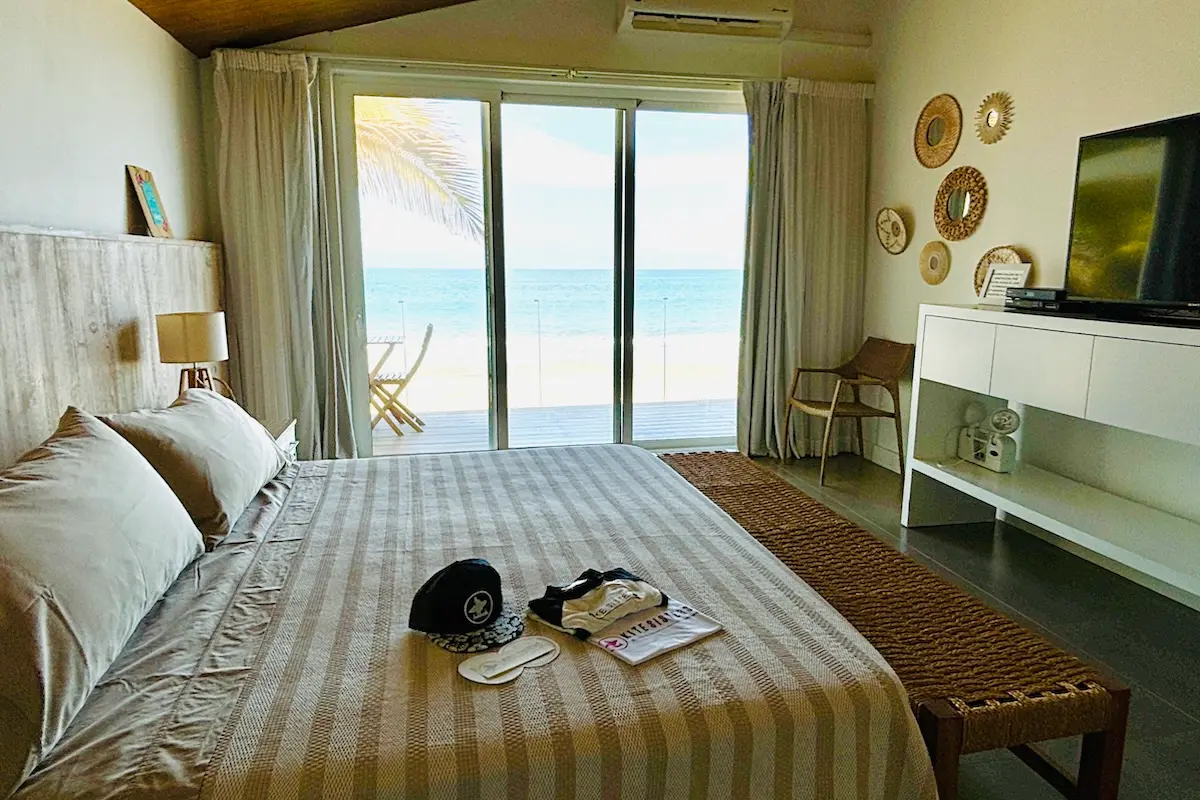 Cozy beachfront bedroom with ocean view at Kite Sisters women's kiteboarding camp in Peru.