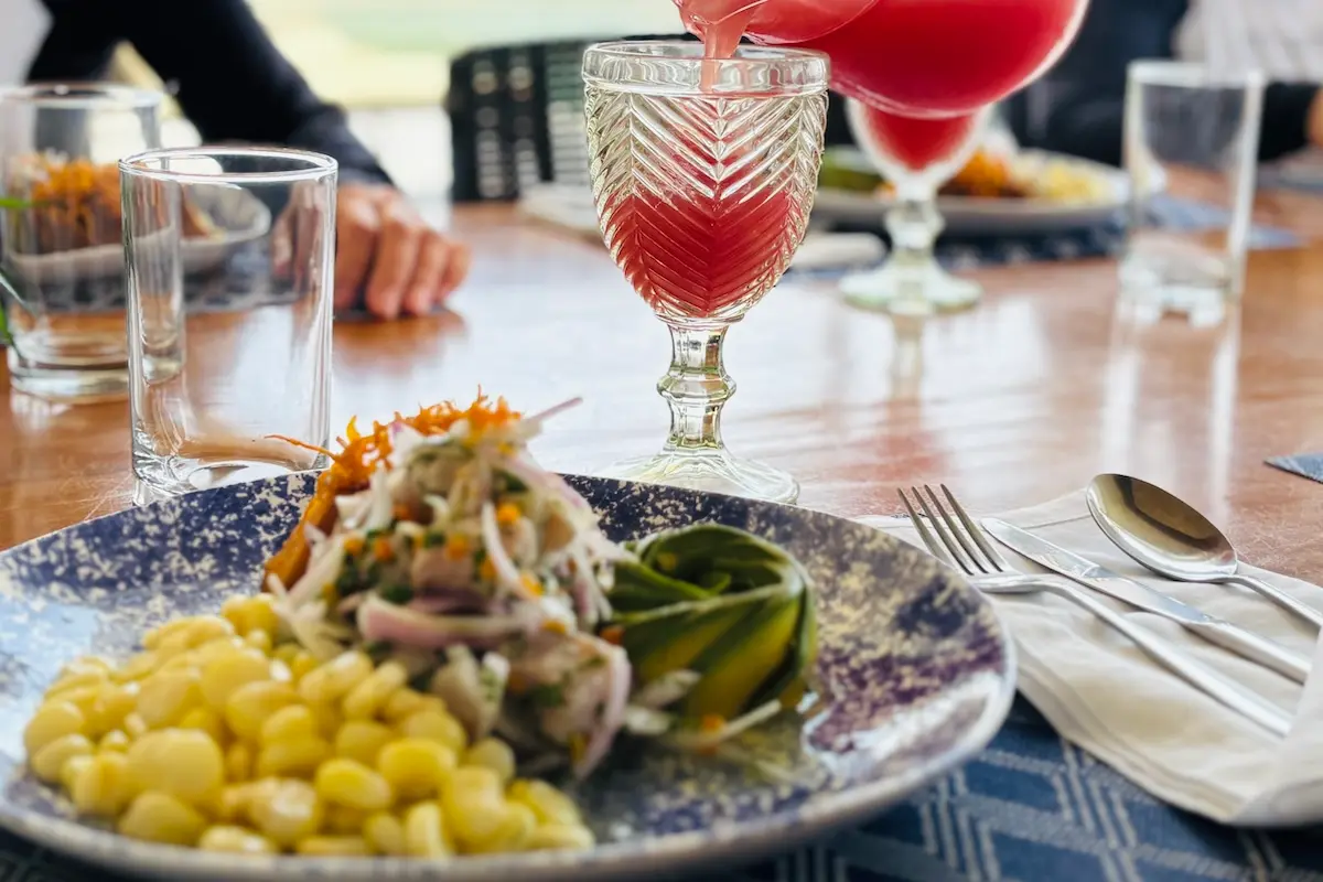 Traditional Peruvian ceviche with corn and fresh juice served at Kite Sisters women's kiteboarding camp.